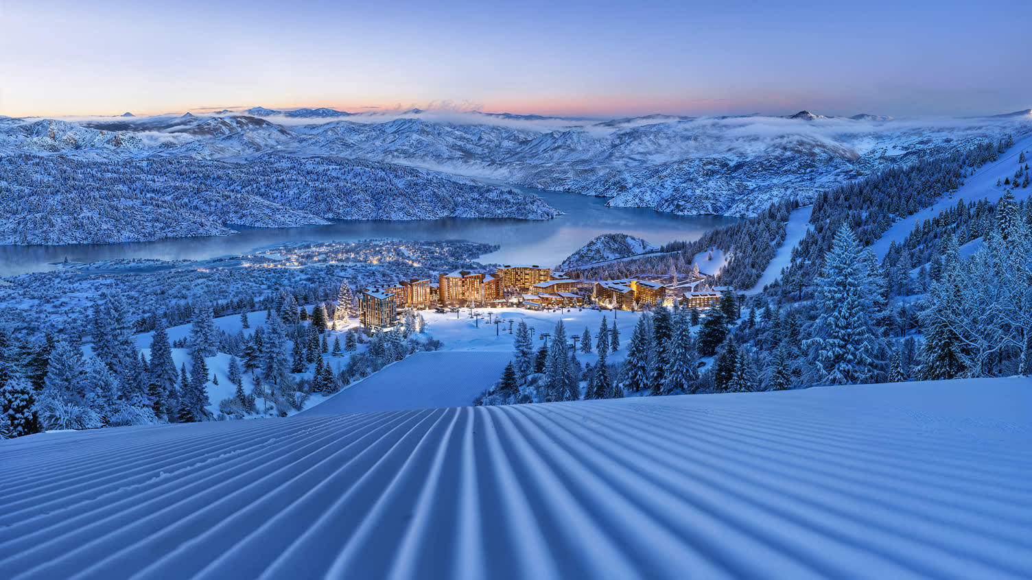 Deer Valley East Village at winter twilight, from the slopes above