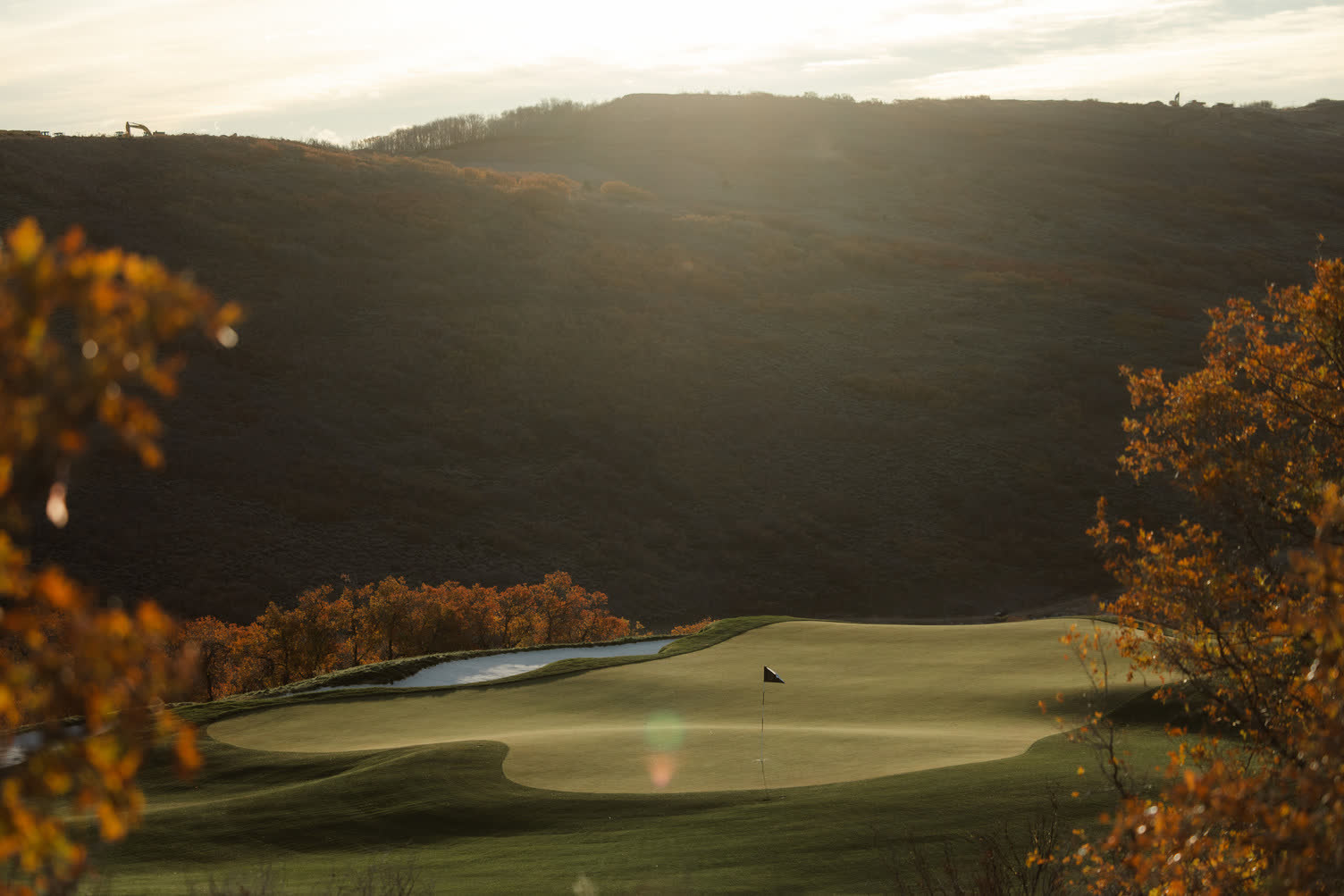 Championship green at golden hour, Wasatch backdrop