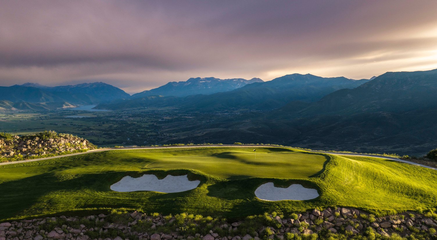 Marcella green above the valley at dusk